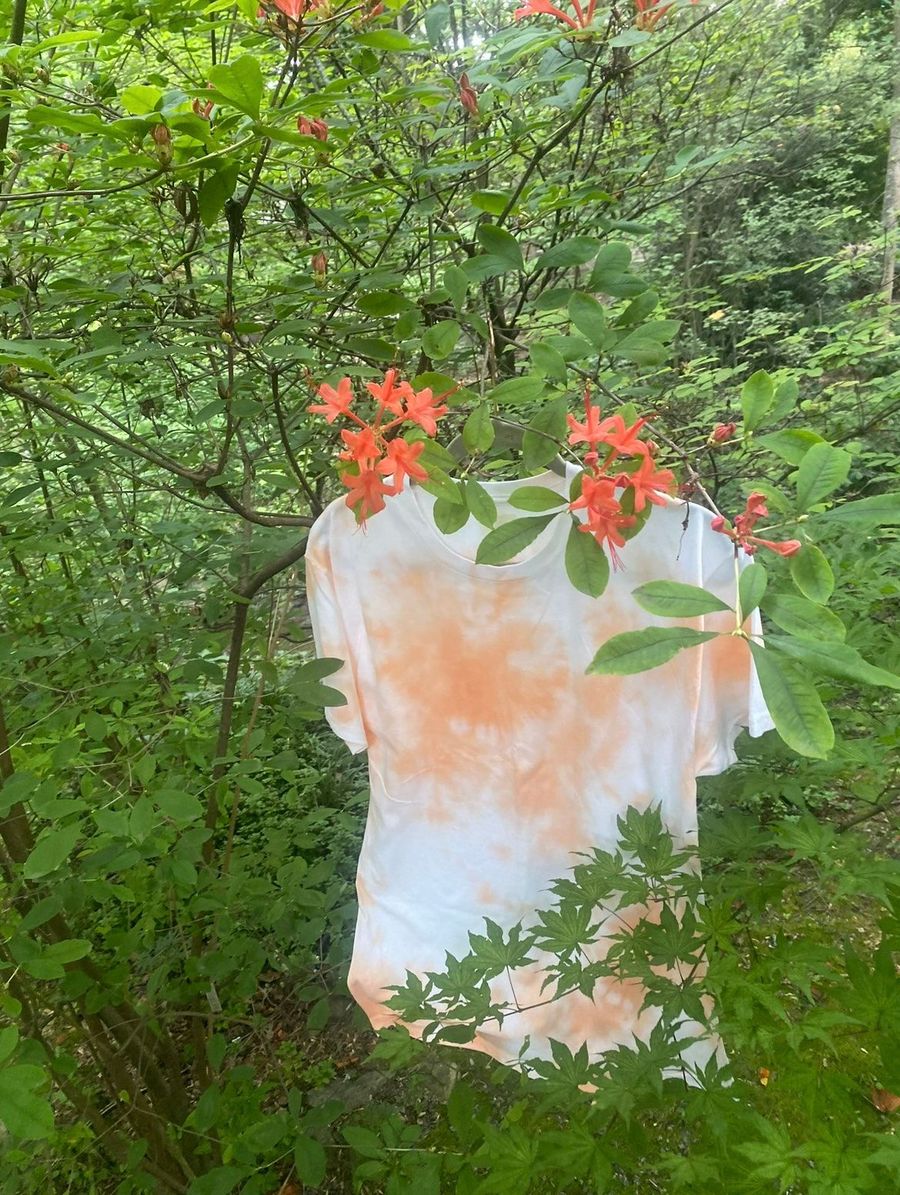 A hand-dyed tee drying outdoors